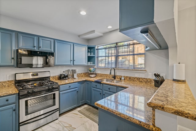 1926 Blodgett St, Houston, TX 77004 - kitchen featuring black microwave, gas range, blue cabinets, light marble finish flooring, and recessed lighting