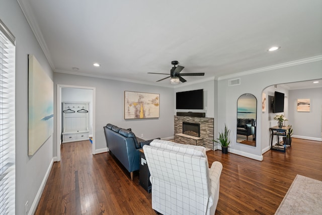 1926 Blodgett St, Houston, TX 77004 - living area with ceiling fan, a stone fireplace, dark wood-style floors, recessed lighting, and arched walkways