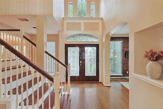 1423 Meadow Lakes Dr, Sugar Land, TX 77479 - entryway featuring plenty of natural light, a high ceiling, wood finished floors, and stairway