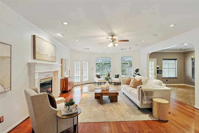 1423 Meadow Lakes Dr, Sugar Land, TX 77479 - living area with arched walkways, ornamental molding, ceiling fan, light wood-type flooring, and recessed lighting