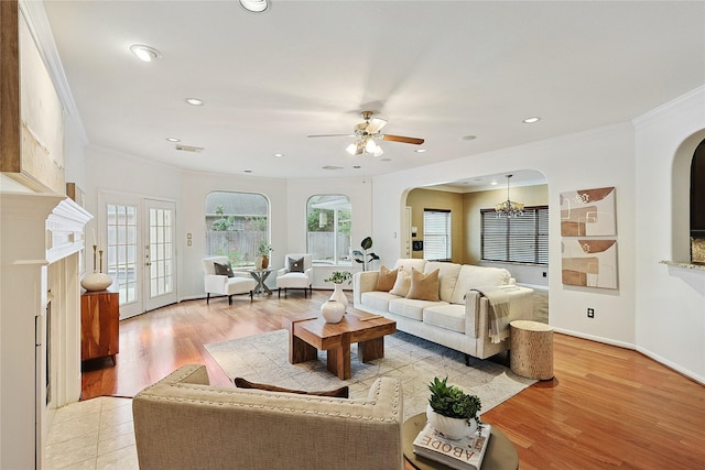 1423 Meadow Lakes Dr, Sugar Land, TX 77479 - living room with arched walkways, ornamental molding, ceiling fan, recessed lighting, and light wood-type flooring