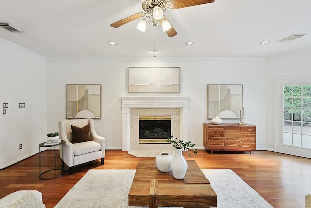 1423 Meadow Lakes Dr, Sugar Land, TX 77479 - living room with ornamental molding, wood finished floors, ceiling fan, recessed lighting, and a glass covered fireplace