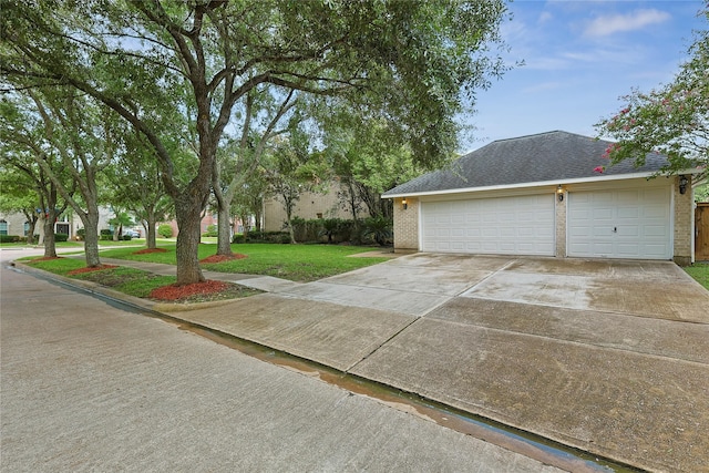 1423 Meadow Lakes Dr, Sugar Land, TX 77479 - view of property exterior with driveway, a lawn, brick siding, and an attached garage