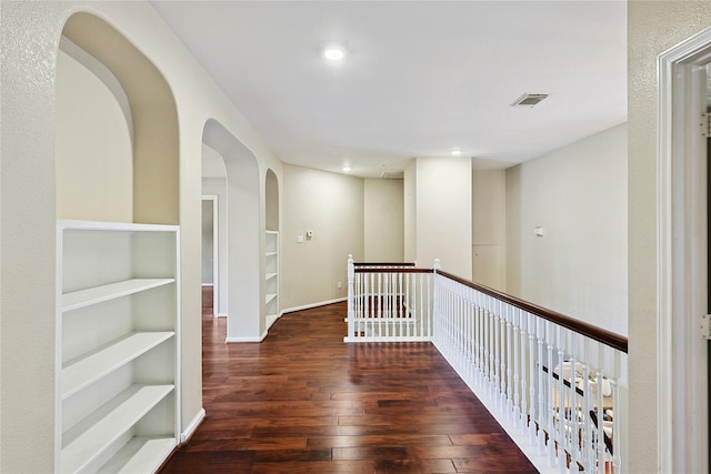 1423 Meadow Lakes Dr, Sugar Land, TX 77479 - hall with built in shelves, wood-type flooring, recessed lighting, and arched walkways