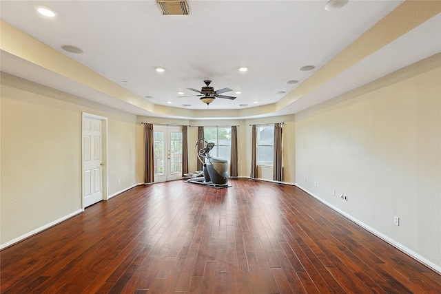 1423 Meadow Lakes Dr, Sugar Land, TX 77479 - workout room featuring french doors, dark wood-type flooring, a ceiling fan, a raised ceiling, and recessed lighting