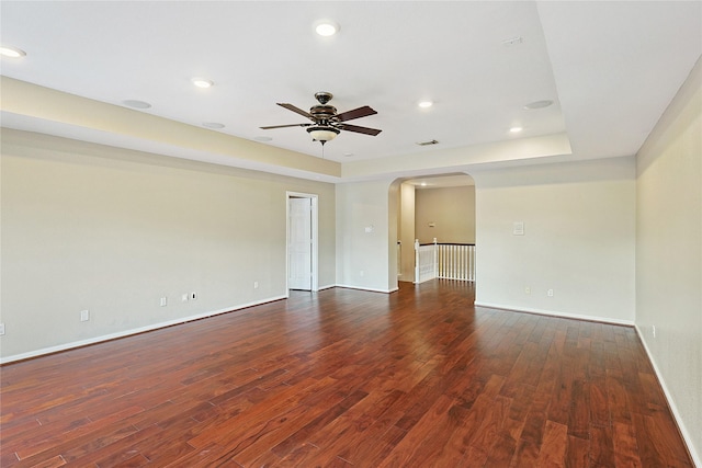 1423 Meadow Lakes Dr, Sugar Land, TX 77479 - spare room with ceiling fan, arched walkways, dark wood finished floors, and recessed lighting