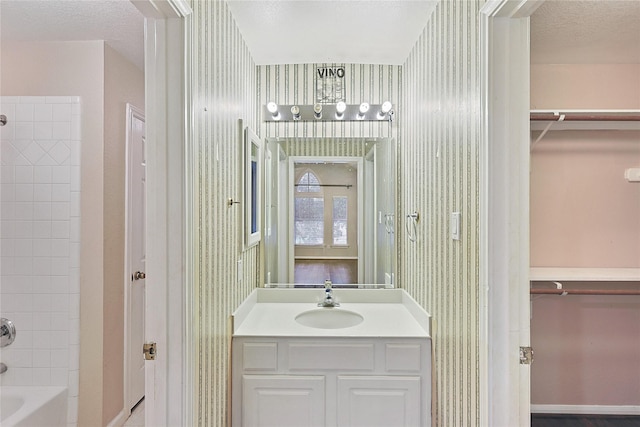 1423 Meadow Lakes Dr, Sugar Land, TX 77479 - bathroom featuring wallpapered walls, vanity, a closet, and shower / bath combination