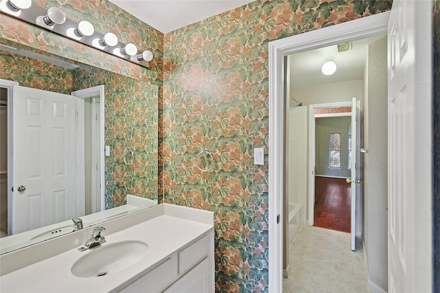 1423 Meadow Lakes Dr, Sugar Land, TX 77479 - bathroom featuring wallpapered walls, vanity, shower / bath combination with curtain, and tile patterned flooring