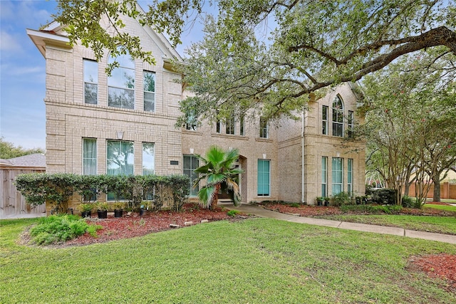 1423 Meadow Lakes Dr, Sugar Land, TX 77479 - view of front of property featuring a front yard and brick siding