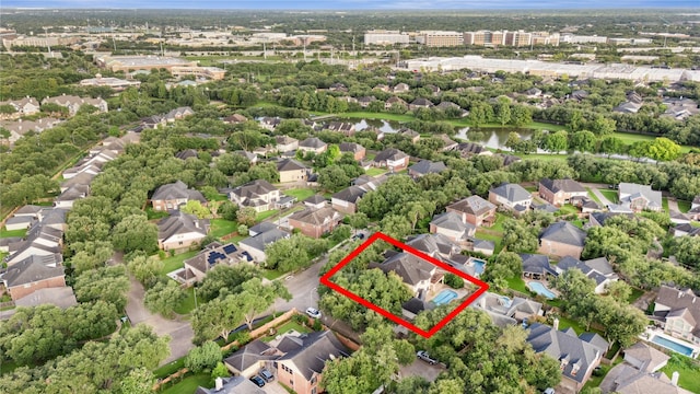 1423 Meadow Lakes Dr, Sugar Land, TX 77479 - aerial view of residential area with a nearby body of water and property boundaries highlighted