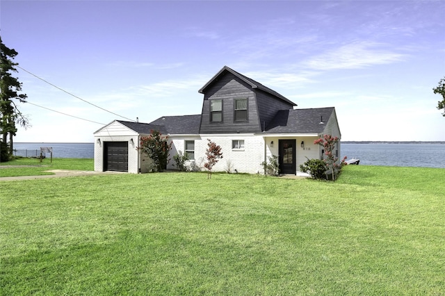 810 W Cattle Dr, Onalaska, TX 77360 - view of front of house with a front yard, concrete driveway, and an attached garage