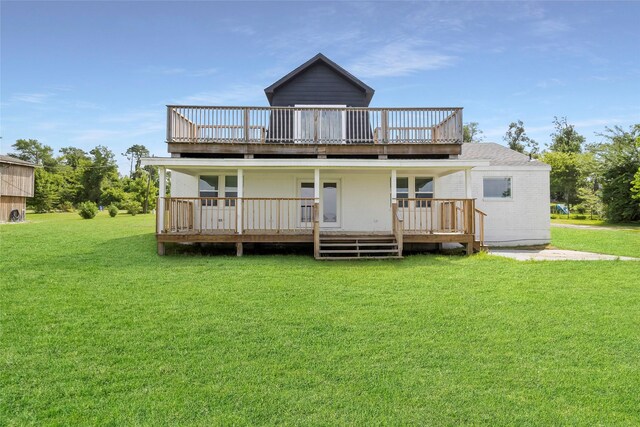 810 W Cattle Dr, Onalaska, TX 77360 - rear view of property featuring a lawn and a deck