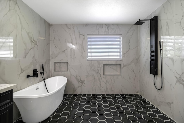 810 W Cattle Dr, Onalaska, TX 77360 - full bath with a soaking tub, vanity, a marble finish shower, and tile walls
