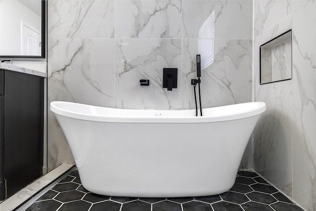 810 W Cattle Dr, Onalaska, TX 77360 - full bath with a freestanding tub, vanity, and tile patterned floors
