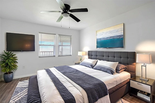 810 W Cattle Dr, Onalaska, TX 77360 - bedroom with wood finished floors and a ceiling fan