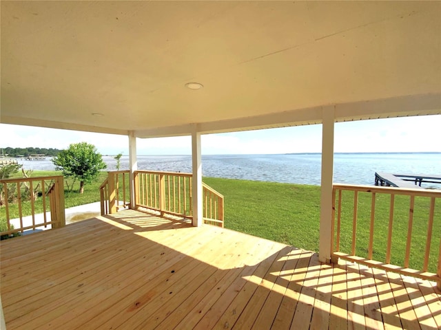 810 W Cattle Dr, Onalaska, TX 77360 - wooden terrace featuring a water view and a lawn