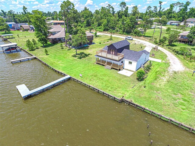 810 W Cattle Dr, Onalaska, TX 77360 - aerial view of property and surrounding area featuring a large body of water