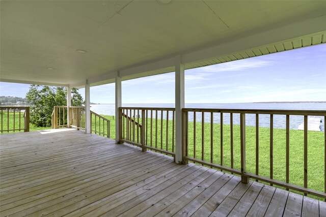 810 W Cattle Dr, Onalaska, TX 77360 - deck featuring a water view and a yard