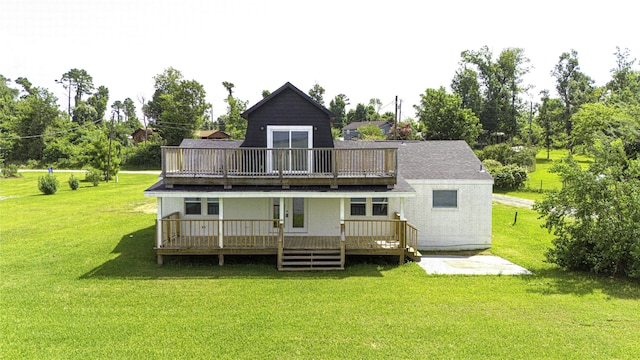 810 W Cattle Dr, Onalaska, TX 77360 - back of property with a deck and a yard