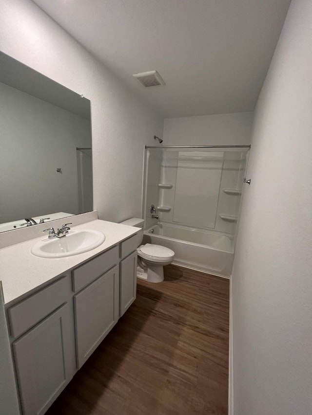 4127 Neches Bend Dr, Baytown, TX 77521 - full bathroom with wood finished floors, vanity, and shower / washtub combination