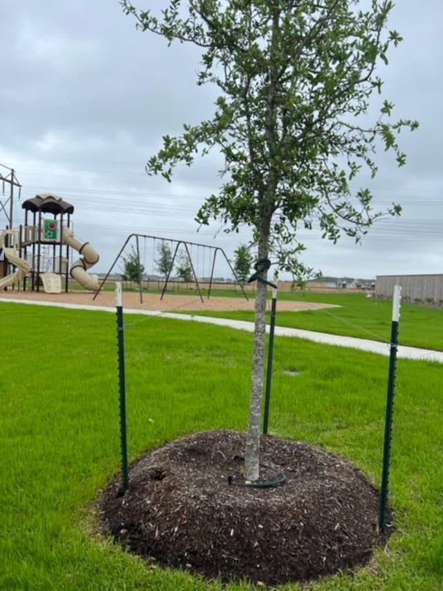 4127 Neches Bend Dr, Baytown, TX 77521 - view of property's community with a lawn