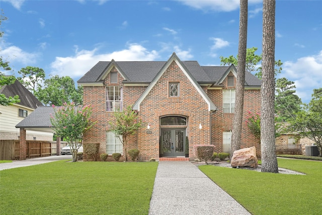 6710 Blue Hills Rd, Houston, TX 77069 - view of front of home featuring french doors, brick siding, and roof with shingles