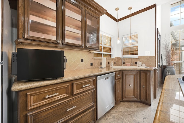 6710 Blue Hills Rd, Houston, TX 77069 - kitchen with stainless steel dishwasher, glass insert cabinets, decorative backsplash, hanging light fixtures, and light stone countertops