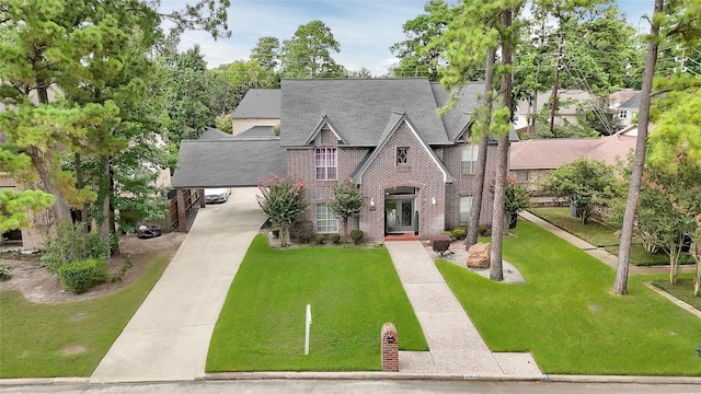 6710 Blue Hills Rd, Houston, TX 77069 - tudor house with brick siding, concrete driveway, a front yard, a shingled roof, and an attached carport