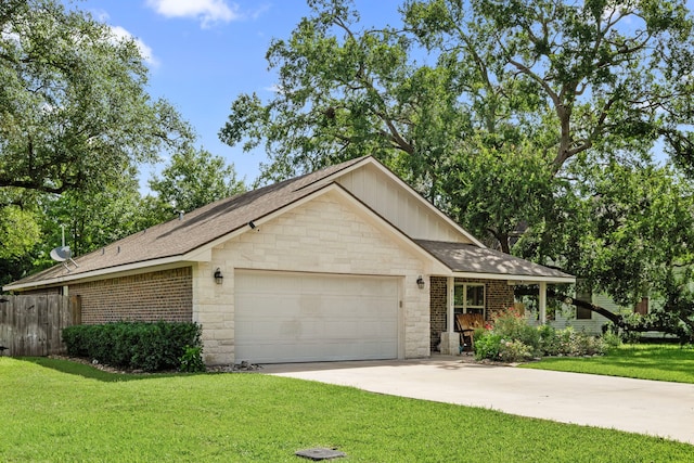 6112 Guyler St, Wallis, TX 77485 - ranch-style home featuring a garage, driveway, stone siding, and roof with shingles