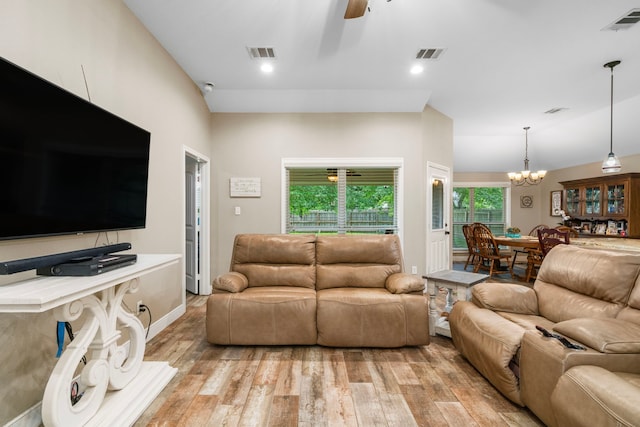 6112 Guyler St, Wallis, TX 77485 - living room featuring light wood-style flooring, ceiling fan, a chandelier, and recessed lighting