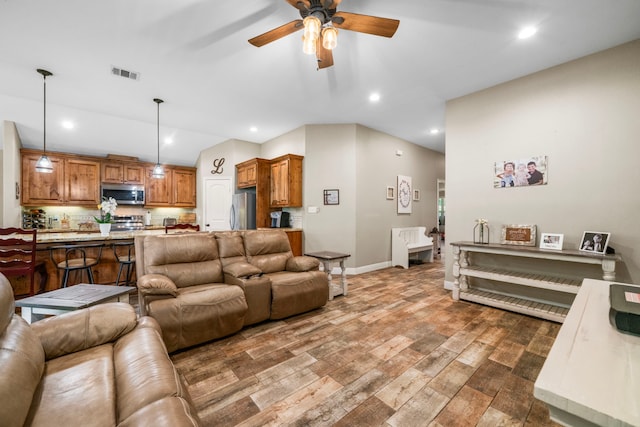 6112 Guyler St, Wallis, TX 77485 - living area with wood finished floors, a ceiling fan, and recessed lighting