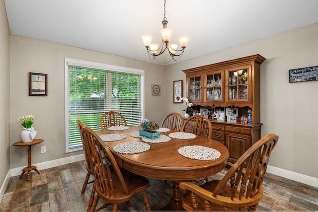 6112 Guyler St, Wallis, TX 77485 - dining space with a chandelier and dark wood finished floors