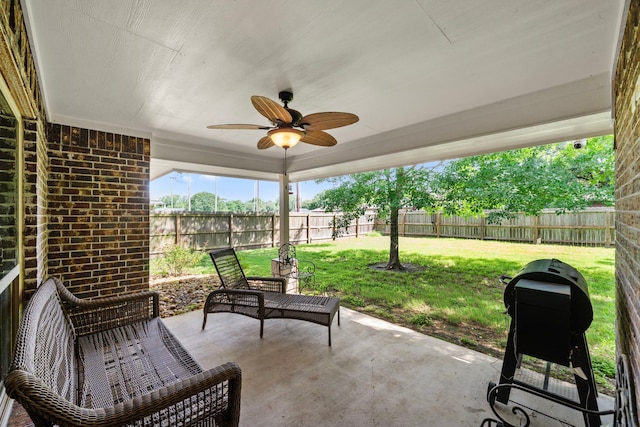 6112 Guyler St, Wallis, TX 77485 - fenced backyard featuring ceiling fan and a patio area