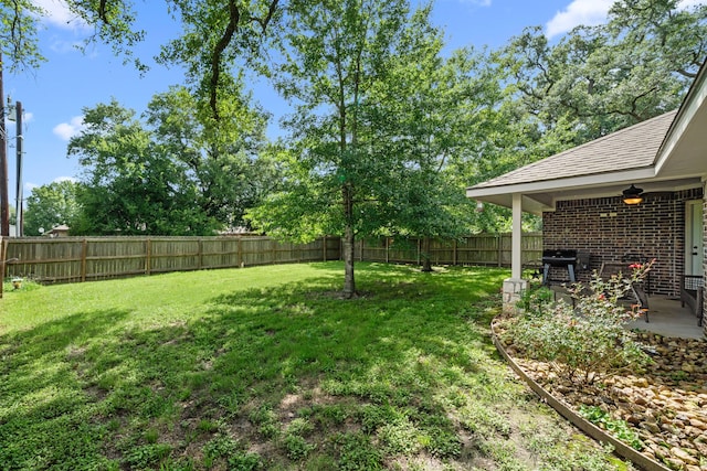 6112 Guyler St, Wallis, TX 77485 - fenced backyard featuring a patio area