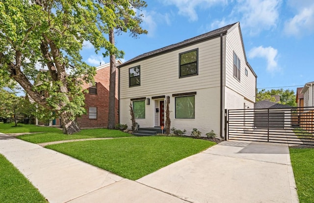 3021 Prospect St, Houston, TX 77004 - view of front of house featuring a front lawn, driveway, and brick siding