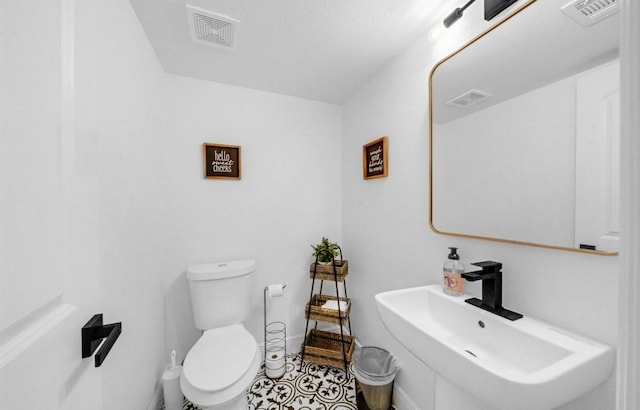 3021 Prospect St, Houston, TX 77004 - half bath with a sink and tile patterned floors