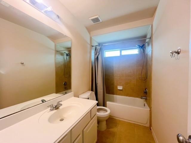 14706 Branchwest Dr, Houston, TX 77082 - bathroom featuring vanity, shower / bath combination with curtain, and tile patterned floors