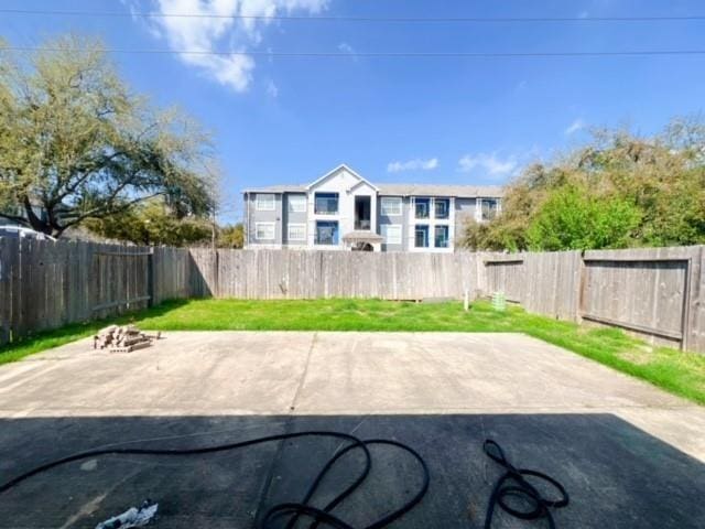 14706 Branchwest Dr, Houston, TX 77082 - fenced backyard featuring a patio and an outdoor fire pit