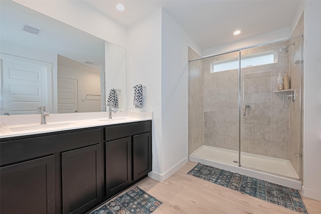 30119 Ousel Falls Ln, Katy, TX 77494 - full bath with a shower stall, double vanity, wood finished floors, and recessed lighting