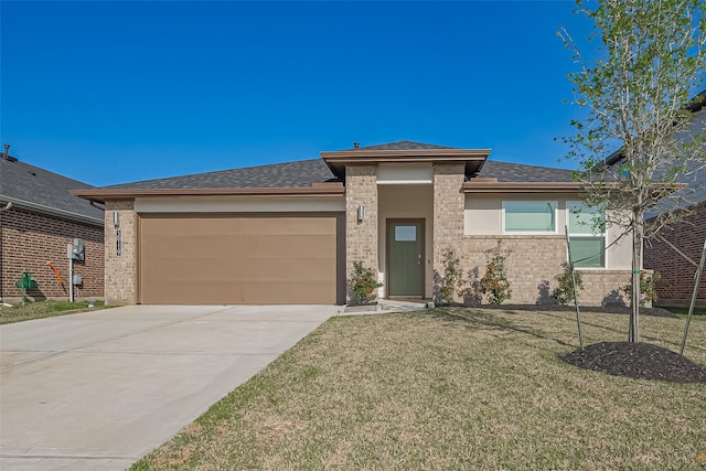 30119 Ousel Falls Ln, Katy, TX 77494 - view of front of property featuring an attached garage, a front lawn, driveway, a shingled roof, and brick siding
