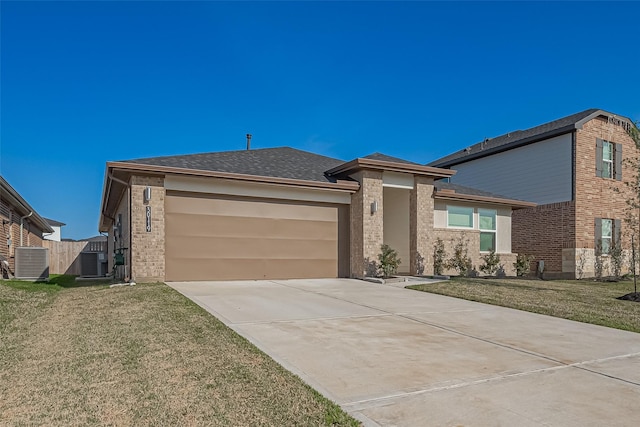 30119 Ousel Falls Ln, Katy, TX 77494 - view of front facade with driveway, a garage, brick siding, and a shingled roof