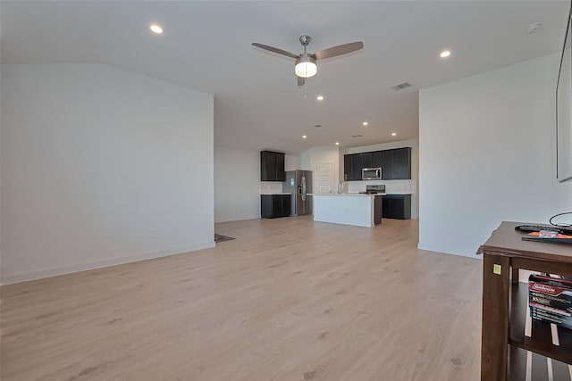 30119 Ousel Falls Ln, Katy, TX 77494 - unfurnished living room with light wood-style floors, a ceiling fan, and recessed lighting