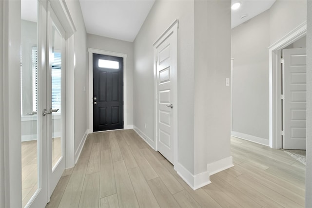 15122 Parkland Canyon Dr, Cypress, TX 77433 - foyer entrance featuring baseboards and light wood-style flooring
