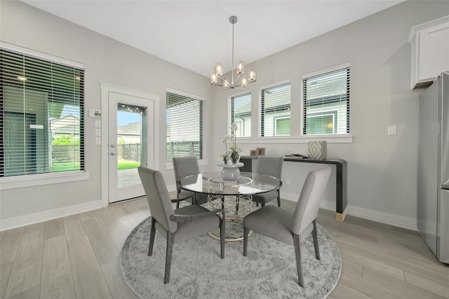 15122 Parkland Canyon Dr, Cypress, TX 77433 - dining room with a chandelier and light wood-type flooring