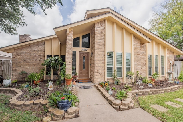 4957 Shadowbend Dr, Corpus Christi, TX 78413 - view of front of home with board and batten siding and a chimney