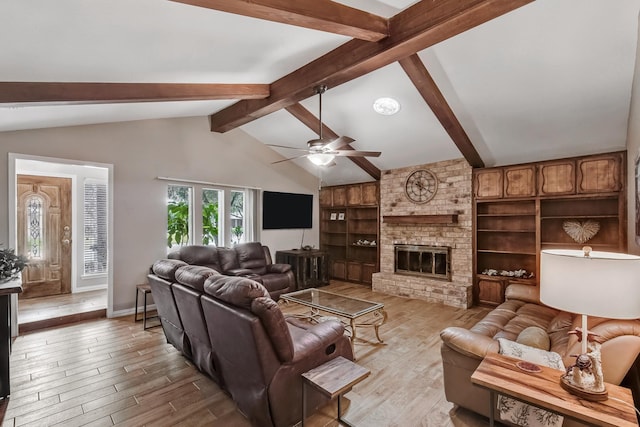 4957 Shadowbend Dr, Corpus Christi, TX 78413 - living area featuring light wood-style floors, a ceiling fan, and a fireplace