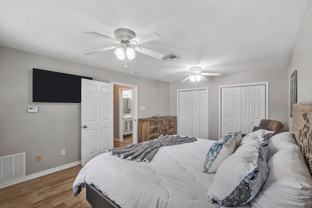 4957 Shadowbend Dr, Corpus Christi, TX 78413 - bedroom with multiple closets, wood finished floors, and a ceiling fan