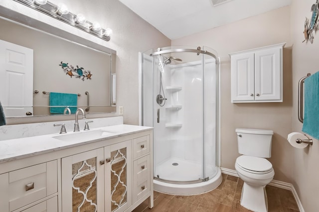 4957 Shadowbend Dr, Corpus Christi, TX 78413 - full bathroom with a stall shower, vanity, and wood finished floors