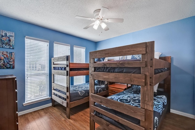4957 Shadowbend Dr, Corpus Christi, TX 78413 - bedroom featuring a textured ceiling, wood finished floors, and ceiling fan