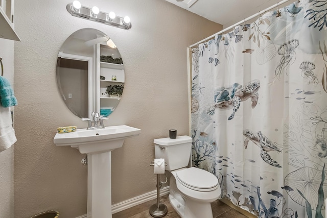 4957 Shadowbend Dr, Corpus Christi, TX 78413 - bathroom featuring toilet and a shower with shower curtain